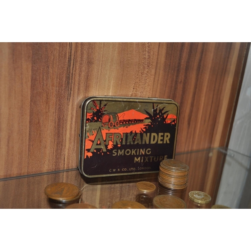 153 - A vintage tin containing a quantity of coins from around the world of various dates