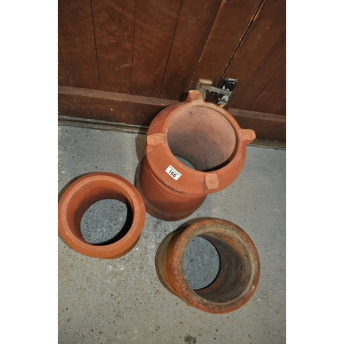 166 - Three cylindrical terracotta chimney pot style planters in varying sizes