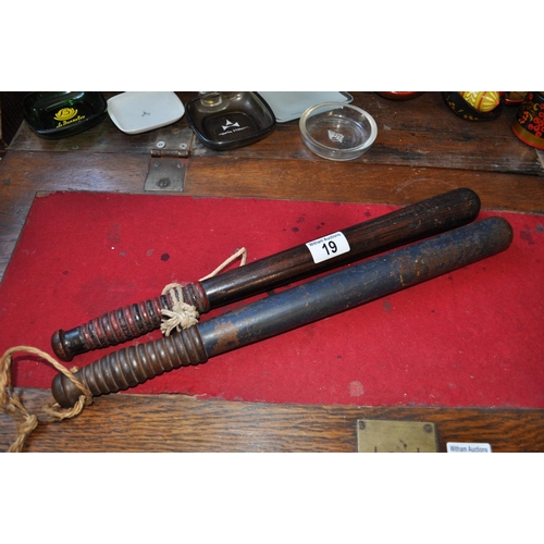 19 - Two antique wooden truncheons