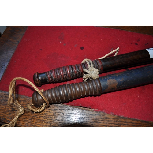 19 - Two antique wooden truncheons