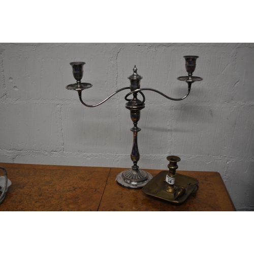 34 - A metamorphic candelabra together with antique Willie Winkie candle holder