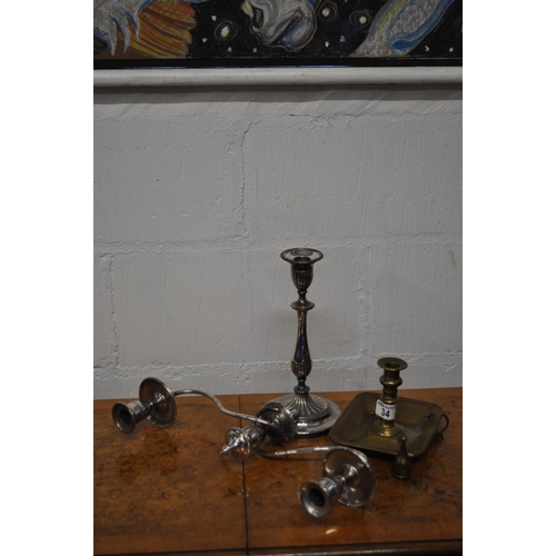 34 - A metamorphic candelabra together with antique Willie Winkie candle holder