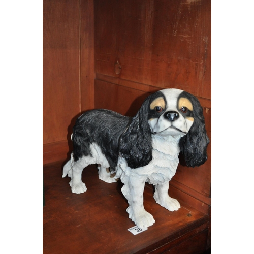 38 - Resin dog in the form of a King Charles Spaniel, measuring approx H 29cm