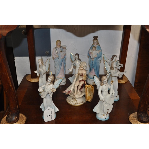 4 - German ceramic angelic figurines together with a period boy cherub holding a swan - a/f