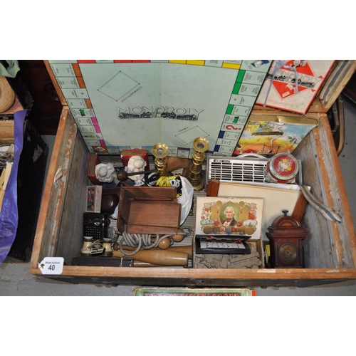 40 - A large wooden box/trunk  containing vintage items including candle holders, book ends, games, pictu... 