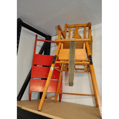 44 - Retro style red sleigh and child's high chair featuring a rabbit design to the back rest