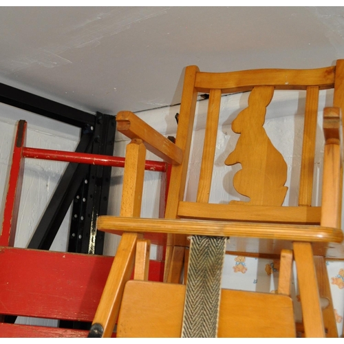 44 - Retro style red sleigh and child's high chair featuring a rabbit design to the back rest