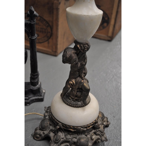 45 - Onyx and brass table lamp with cherub design (PAT tested)  together with heavy cast iron door depict... 