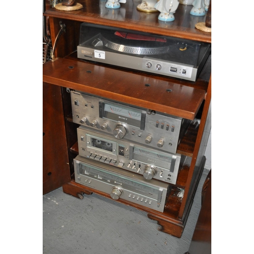 5 - A Sony turntable model PS IPS-212 in a music cabinet with  TC-U5 stereo cassette deck,  TA-313  ampl... 