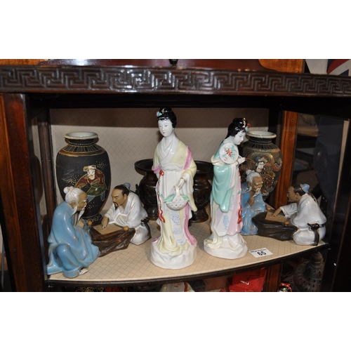 65 - A quantity of oriental ceramic vases, bronze style vases and other figurines