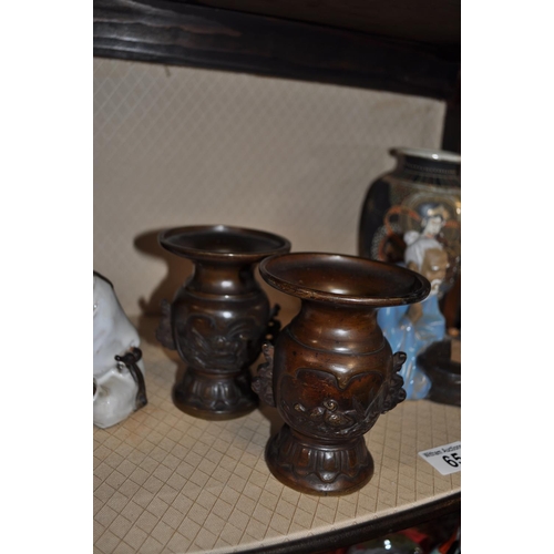 65 - A quantity of oriental ceramic vases, bronze style vases and other figurines