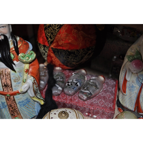 66 - Oriental themed items consisting of scent bottles, figurines and decorative eggs etc.