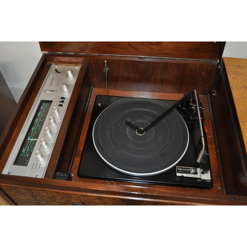 7 - A Dynatron Radiogram and Garrard record player in a cased burr walnut unit together with matching sp... 