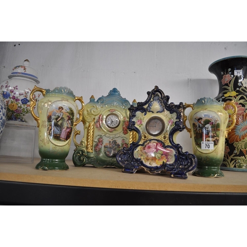 70 - Two Victorian ceramic mantle clocks together with a pair of similar style vases