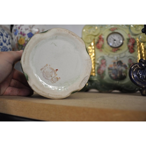 70 - Two Victorian ceramic mantle clocks together with a pair of similar style vases