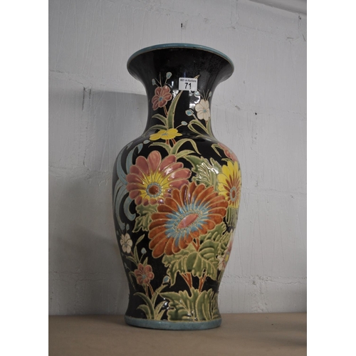 71 - A large ceramic display vase depicting vibrant flowers, overall height 54cm