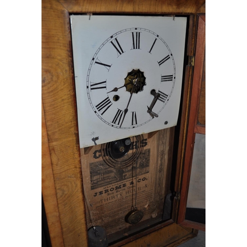 8 - Jerome & Co 30 hour wall clock, with reverse painted lower glass panel together with a vintage mirro... 