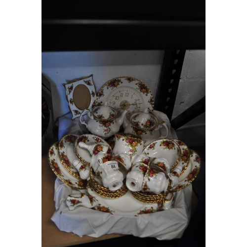 84 - A box of Royal Albert Country Roses porcelain items including; large and small teapots, cups, saucer... 