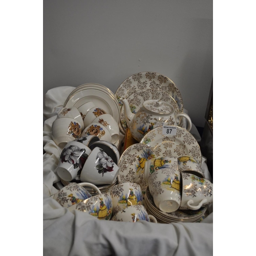 87 - A quantity of retro china/porcelain  cups, saucers, teapot, sugar bowl etc. including Crinoline Lady... 