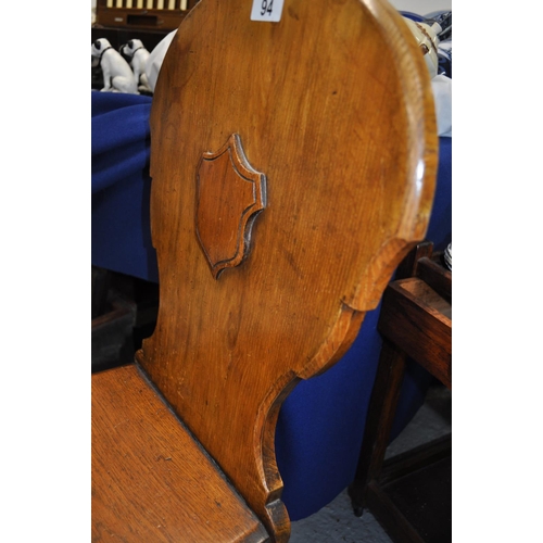 94 - Two antique shield back wooden chairs