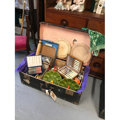 39 - A vintage travelling trunk containing a large quantity of kitchenalia items