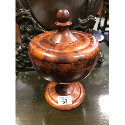 53 - Burr wood design lidded pot containing a quantity of marbles