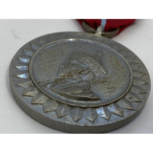 8 - Bhutan a 1974 King of Bhutan Coronation medal, GVF