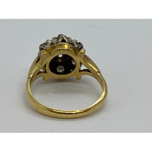 308 - 18ct gold and diamond cluster ring, hallmarked London, approx size K, approx 0.45 total CT