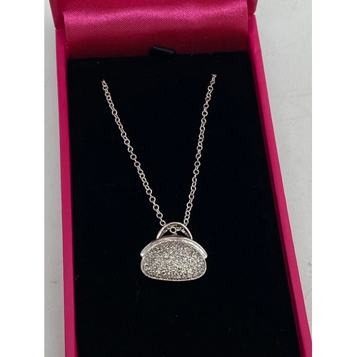 313 - Unusual 14k white gold diamond pave set pendant necklace in the form of a handbag on chain. Approx l... 