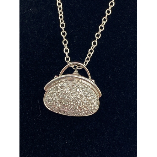 313 - Unusual 14k white gold diamond pave set pendant necklace in the form of a handbag on chain. Approx l... 