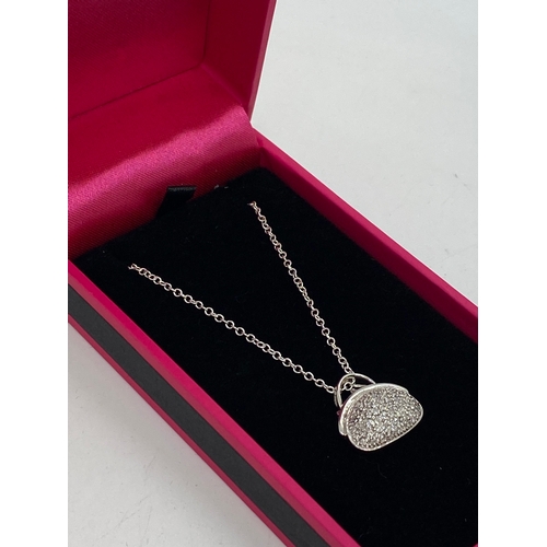 313 - Unusual 14k white gold diamond pave set pendant necklace in the form of a handbag on chain. Approx l... 