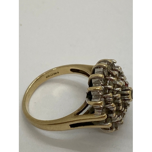 309 - A 9ct yellow gold CZ cluster ring, approx size M, Hallmarked London 375, makers stamp LMJ, approx we... 