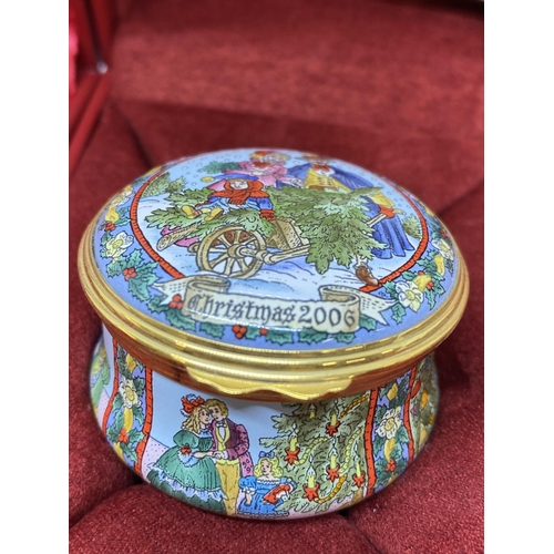 11 - Christmas themed ceramic trinket boxes by Halcyon Days consecutively dating from 2000 to 2007. All b... 