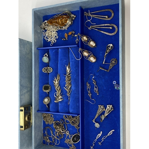 148 - A blue jewellery box containing a quantity of predominately silver items but to include  A pair of d... 