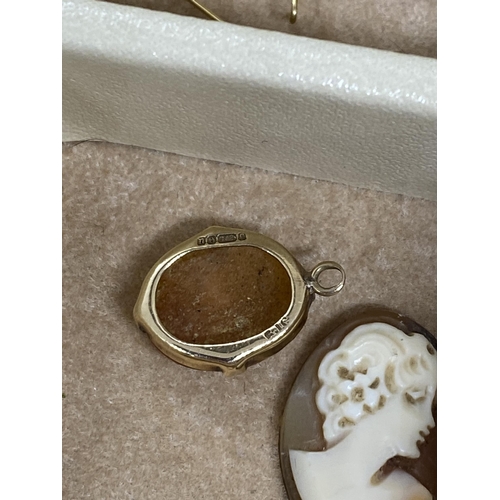 237 - A beige jewellery box containing a quantity of costume jewellery and 9ct yellow gold cameo pendant, ... 