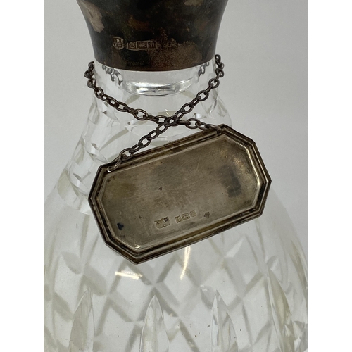 270 - A cut-glass decanter with faceted topper and silver collar hallmarked Birmingham 1973-4, together wi... 