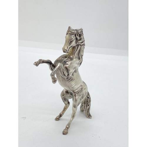 272 - A silver Arabian Stallion in a rearing stance, approx weight 105g