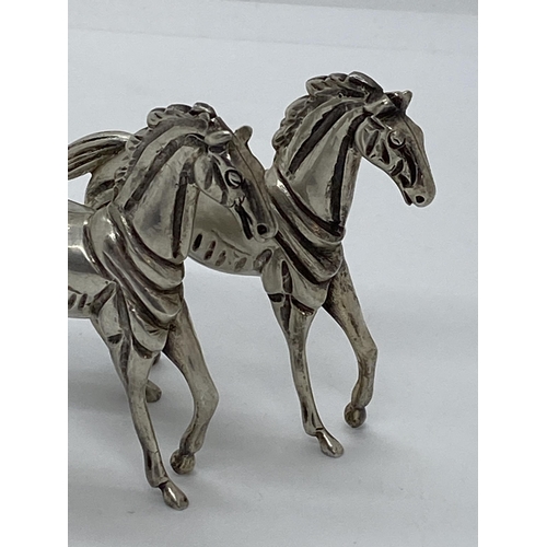 273 - A pair of silver horse figures, approx combined gross weight 180g