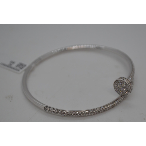 146 - A 18ct white gold hinged bracelet featuring 2.64ct diamonds, approx gross weight 17.5g. This item ha... 