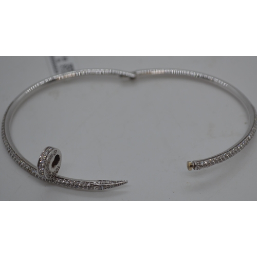 146 - A 18ct white gold hinged bracelet featuring 2.64ct diamonds, approx gross weight 17.5g. This item ha... 