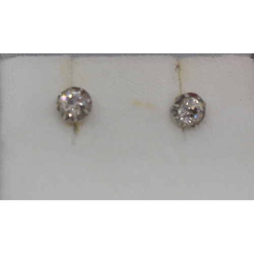 242 - A pair of diamond solitaire earrings, approx 0.50ct each