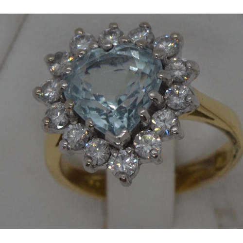 84 - Ladies 18ct yellow gold ring with large central heart shaped central blue stone approx 0.2ct surroun... 