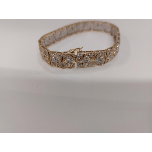 142 - Stunning 14ct gold and diamond cocktail bracelet with push clasp, design depicts multiple rows of di... 