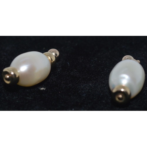 150 - A pair of bespoke 9ct yellow gold pearl stud drop earrings, unmarked tested as 9ct gold, gross weigh... 