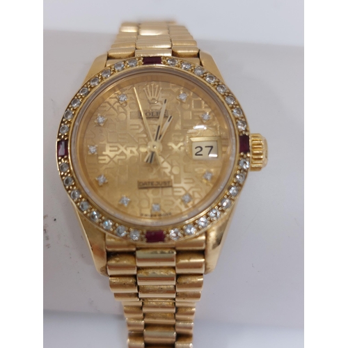 155 - 'Rolex'  A ladies genuine 18ct yellow gold Datejust wristwatch encrusted with diamonds and rubies, h... 