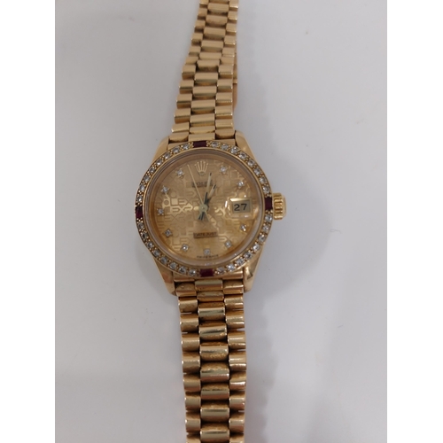 155 - 'Rolex'  A ladies genuine 18ct yellow gold Datejust wristwatch encrusted with diamonds and rubies, h... 