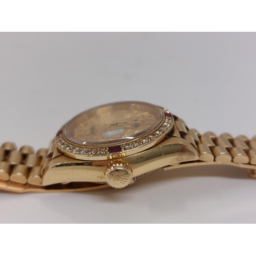 155 - 'Rolex'  A ladies genuine 18ct yellow gold Datejust wristwatch encrusted with diamonds and rubies, h... 