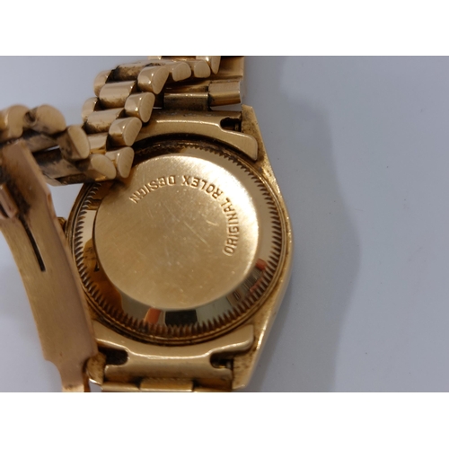 155 - 'Rolex'  A ladies genuine 18ct yellow gold Datejust wristwatch encrusted with diamonds and rubies, h... 