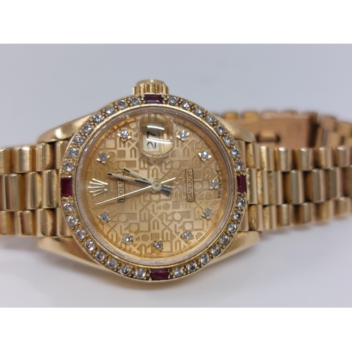 155 - 'Rolex'  A ladies genuine 18ct yellow gold Datejust wristwatch encrusted with diamonds and rubies, h... 