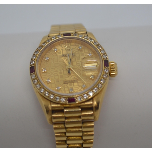 155 - 'Rolex'  A ladies genuine 18ct yellow gold Datejust wristwatch encrusted with diamonds and rubies, h... 